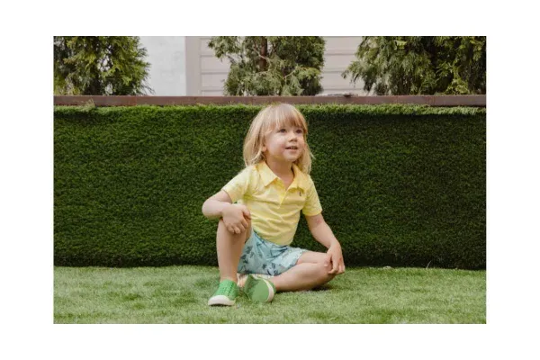 Home 3 A child playing safely in a Conroe, TX yard after professional fire ant treatment